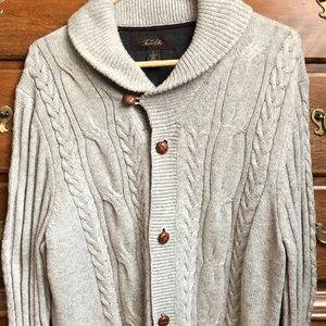 Men’s cableknit cardigan sweater.